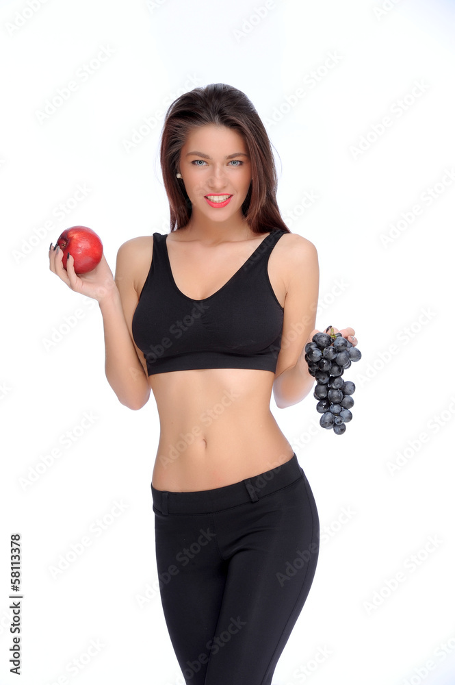 Cute young lady holding red apple while isolated on white..
