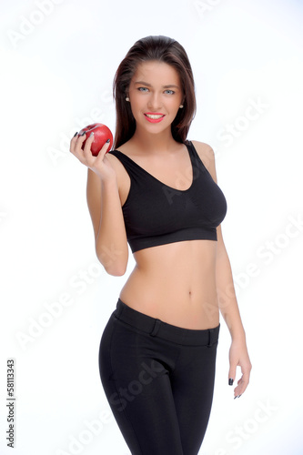 Cute young lady holding red apple while isolated on white..