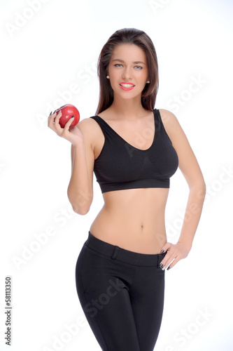 Cute young lady holding red apple while isolated on white..