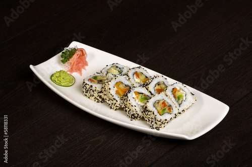 Salmon maki rolls set with sesame seeds