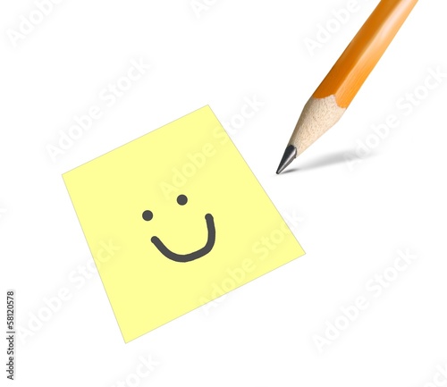 Smile drawn on a yellow post it card
