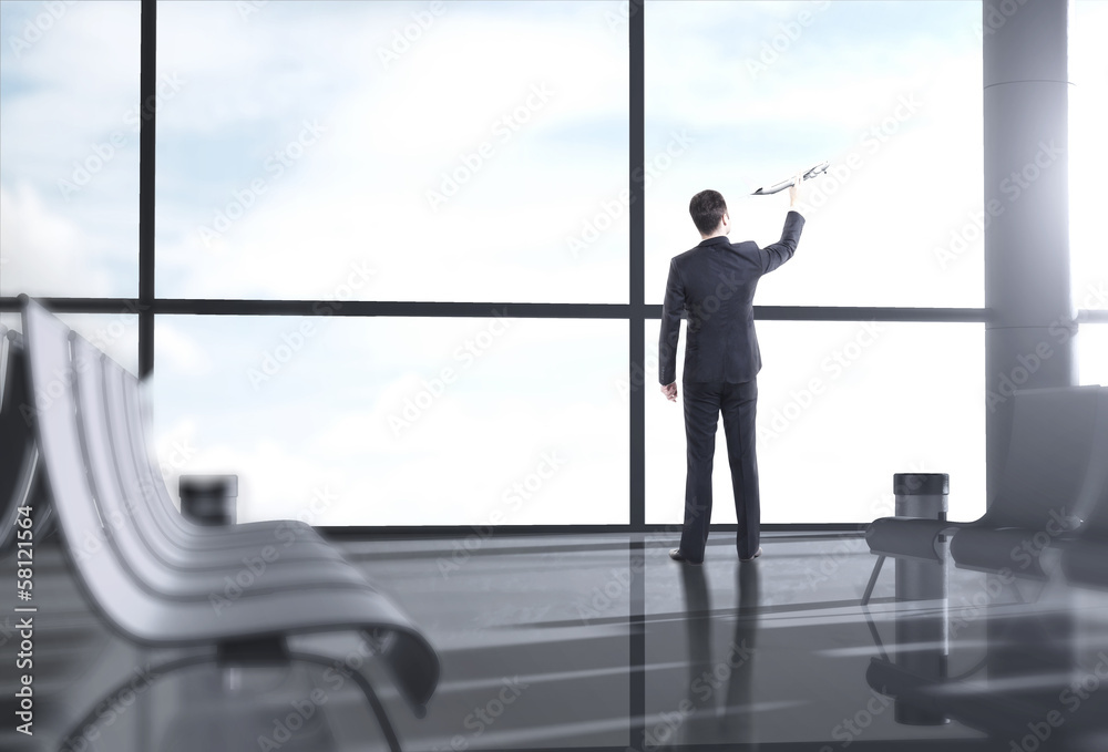 Fototapeta premium businessman holding plane