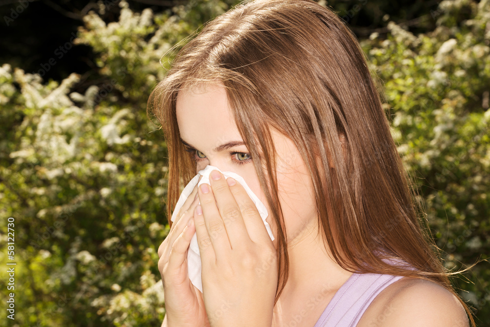 Attractive young woman outdoor with tissue. Attractive young woman outdoor with tissue.