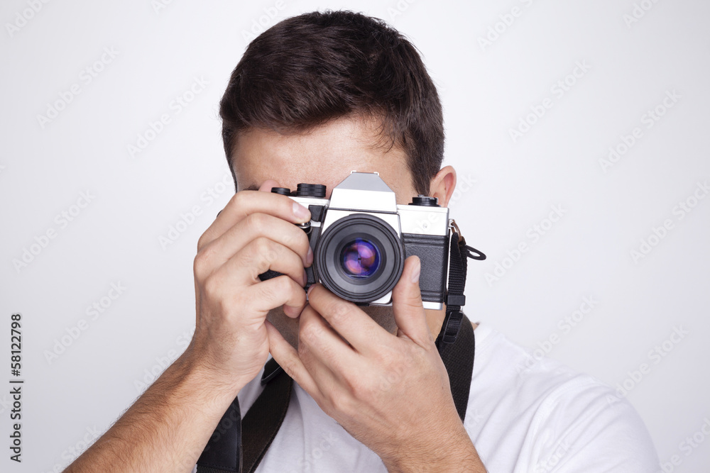 Photographer with camera against gray background Photographer with camera against gray background