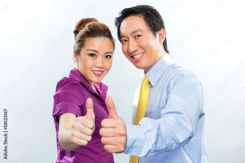 Motivated colleagues in Asian business office Motivated colleagues in Asian business office