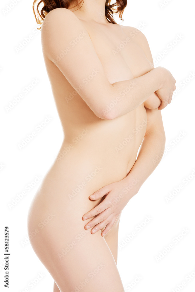 Attractive naked woman covering herself. Attractive naked woman covering herself.