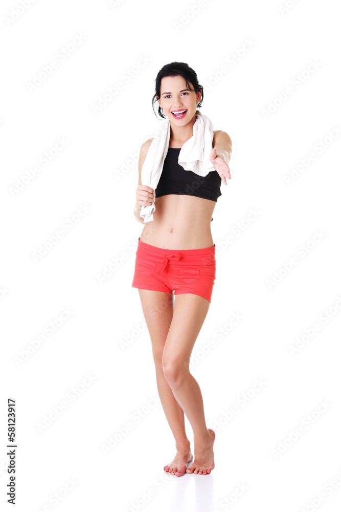 Attractive woman in sportswear and with towel. Attractive woman in sportswear and with towel.