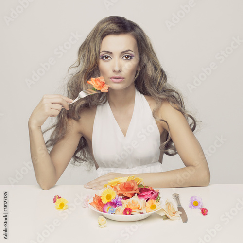 Lady eats flowers