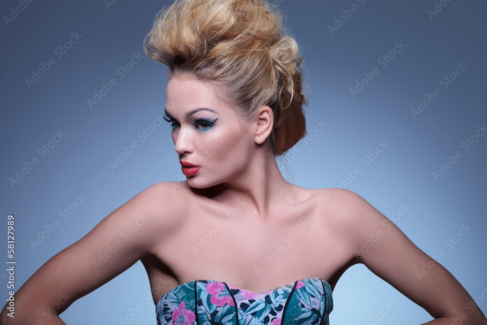 woman with nice make up and hairstyle is looking to her side