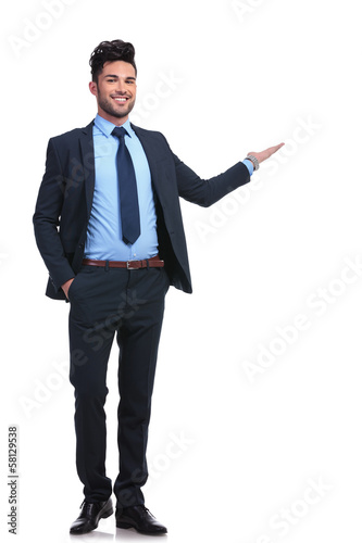 full body picture of a happy business man presenting photo