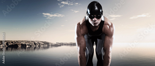 Fotografie Swimmer triathlon muscled man with cap and glasses outdoor at a