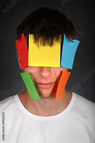 Man with Colored Paper on Face