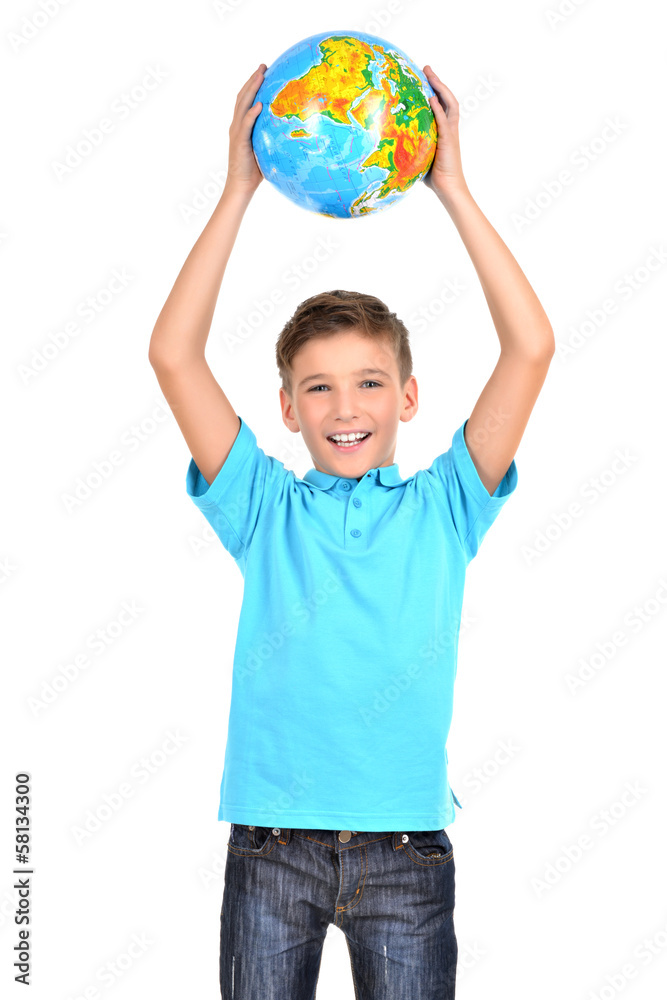 Smiling boy in casual  holding globe in hands above his head
