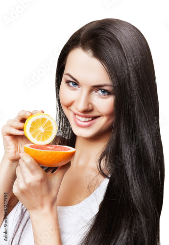 happy girl with grapefruit and lemon in hands