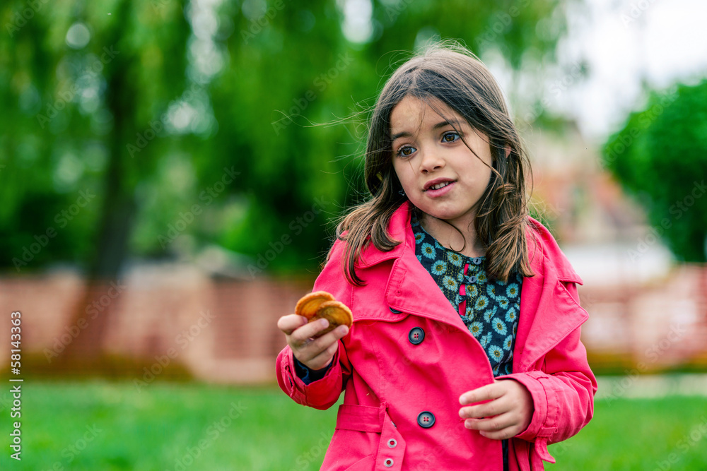 portrait of a pretty girl with cookies in the hands portrait of a pretty girl with cookies in the hands