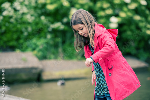 pretty little girl playing at the water's edge © GoodPics