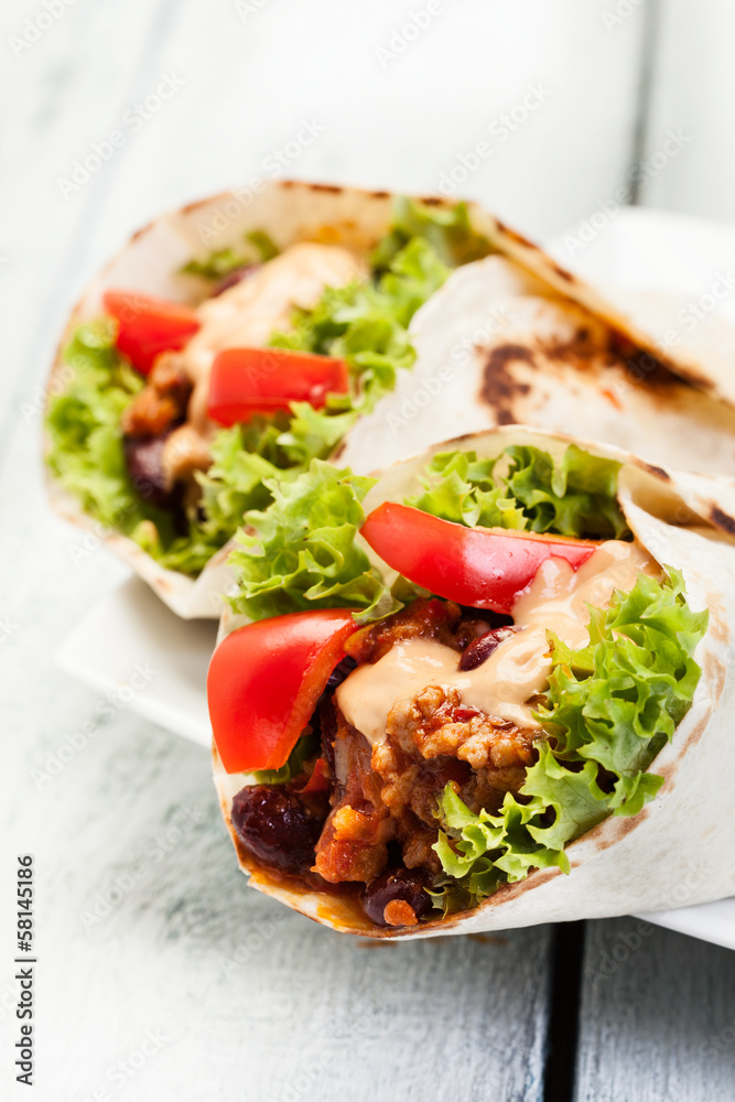 Burrito. Tortilla with meat and beans Burrito. Tortilla with meat and beans