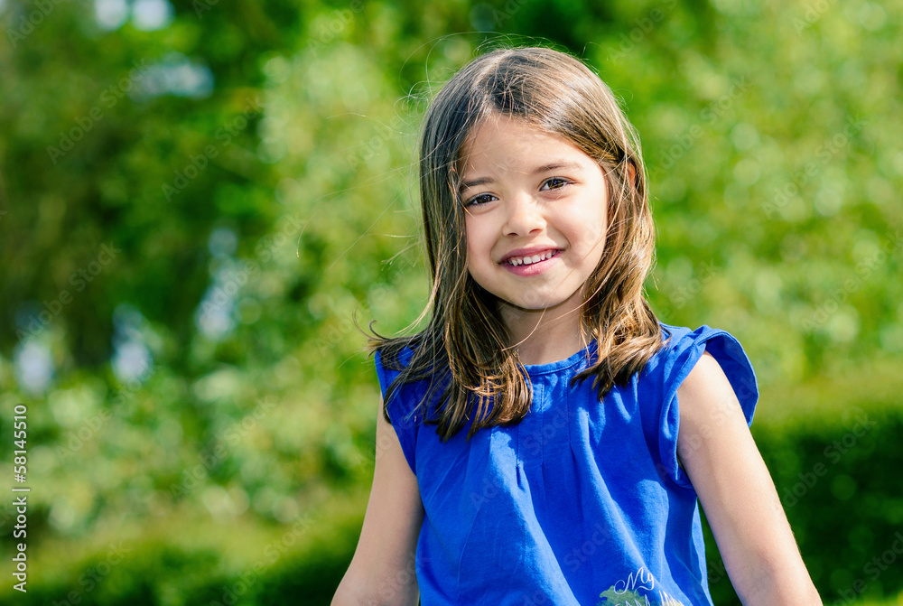 Natural portrait of cute child with greenery in the background Natural portrait of cute child with greenery in the background