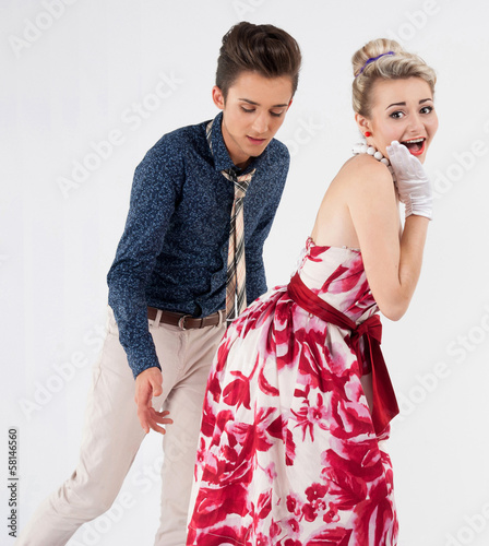Obraz na plátně Man in a vintage suit give a smack stylish woman