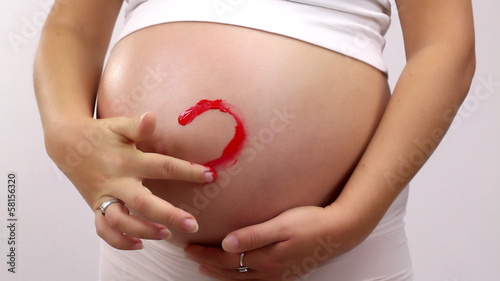 Wallpaper Mural Painting of  heart on pregnant woman's belly Torontodigital.ca