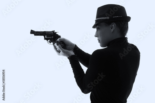 Dangerous woman in black with big handgun