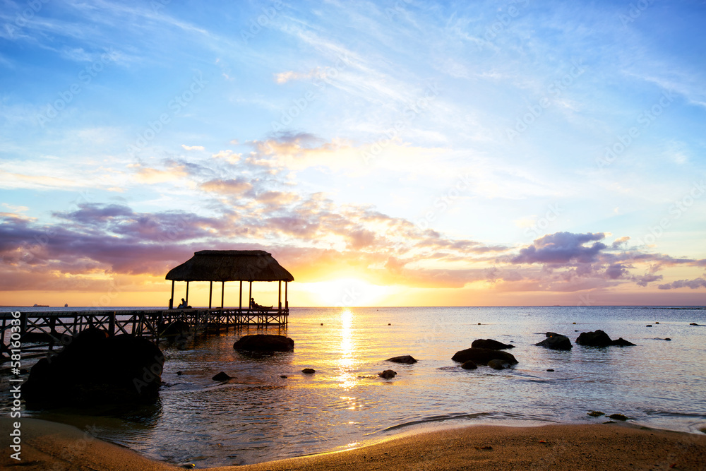 Jetty silhouette against sunset in Mauritius Jetty silhouette against sunset in Mauritius