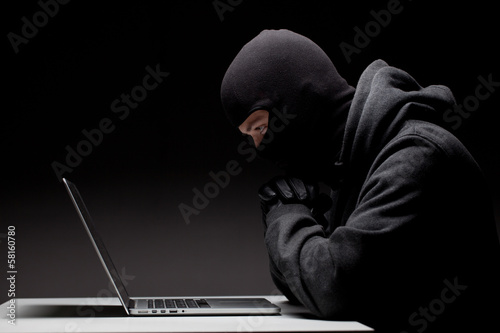 Computer hacker in a balaclava