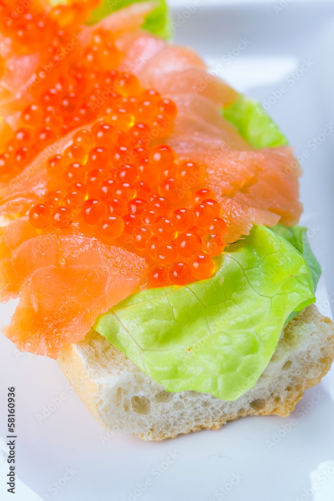 Red caviar and smoked salmon sandwich