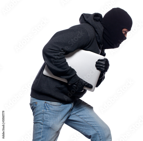 Fotografia Thief stealing a laptop computer
