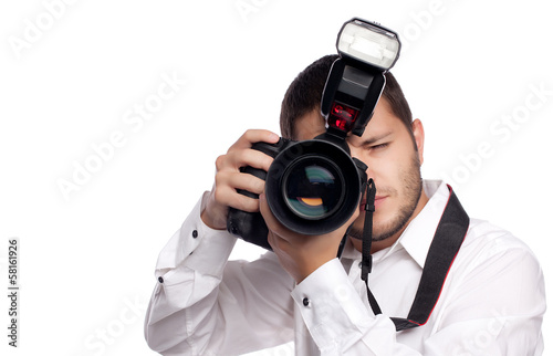 Young man taking photo with professional camera