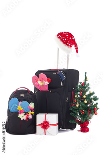 christmas trip - suitcase and packpack, giftbox and christmas tr © Di Studio