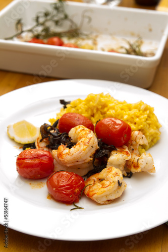 Prawns with risotto rice and tomatoes