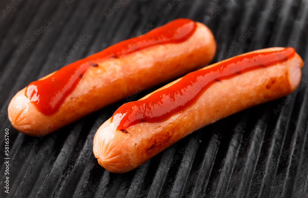 Sausages on a grill