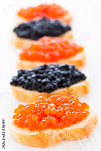 Sandwiches with black and red caviar