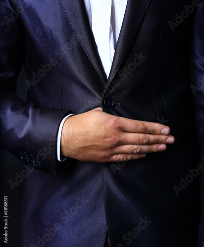 Close up of stylish man in elegant black suit