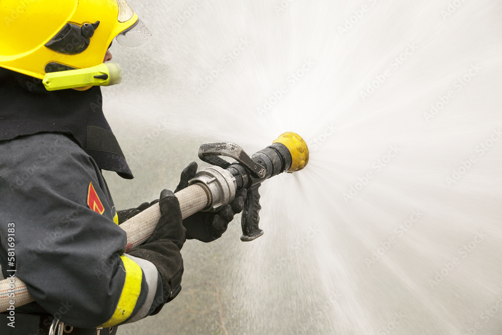Naklejka premium firefighter in action