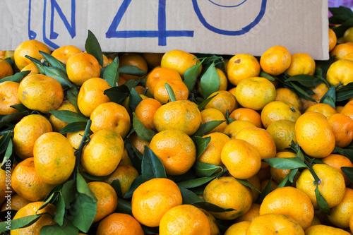 Fotografija Bunch of fresh mandarin oranges on market