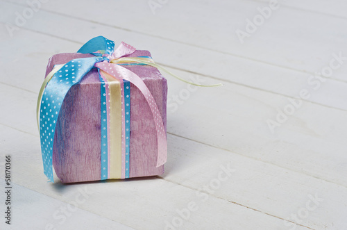Beautifully wrapped gift in purple paper