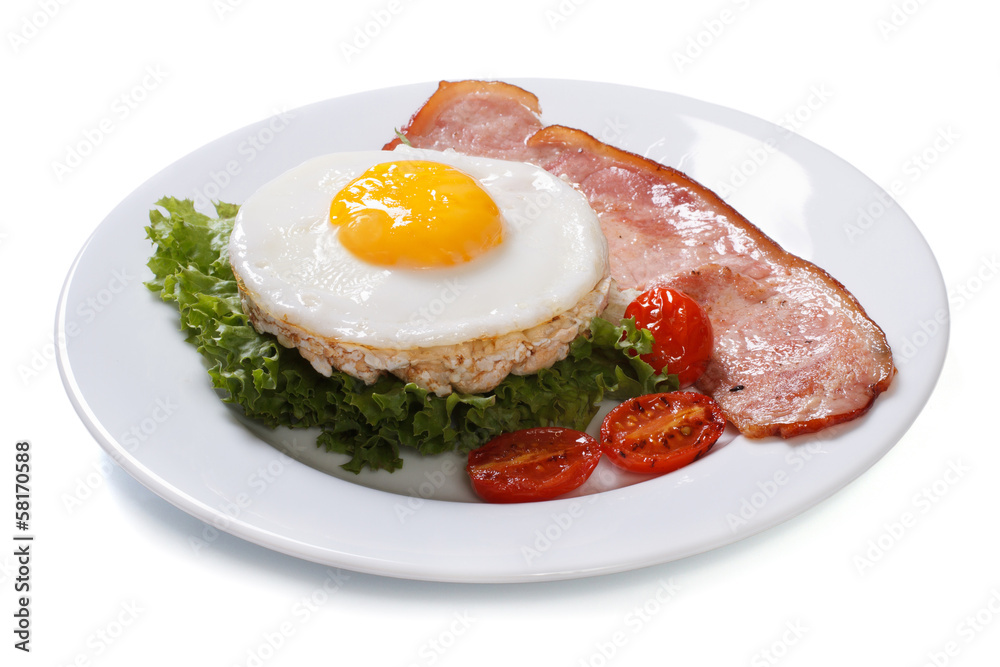 fried eggs with bacon, lettuce and tomato isolated on white fried eggs with bacon, lettuce and tomato isolated on white