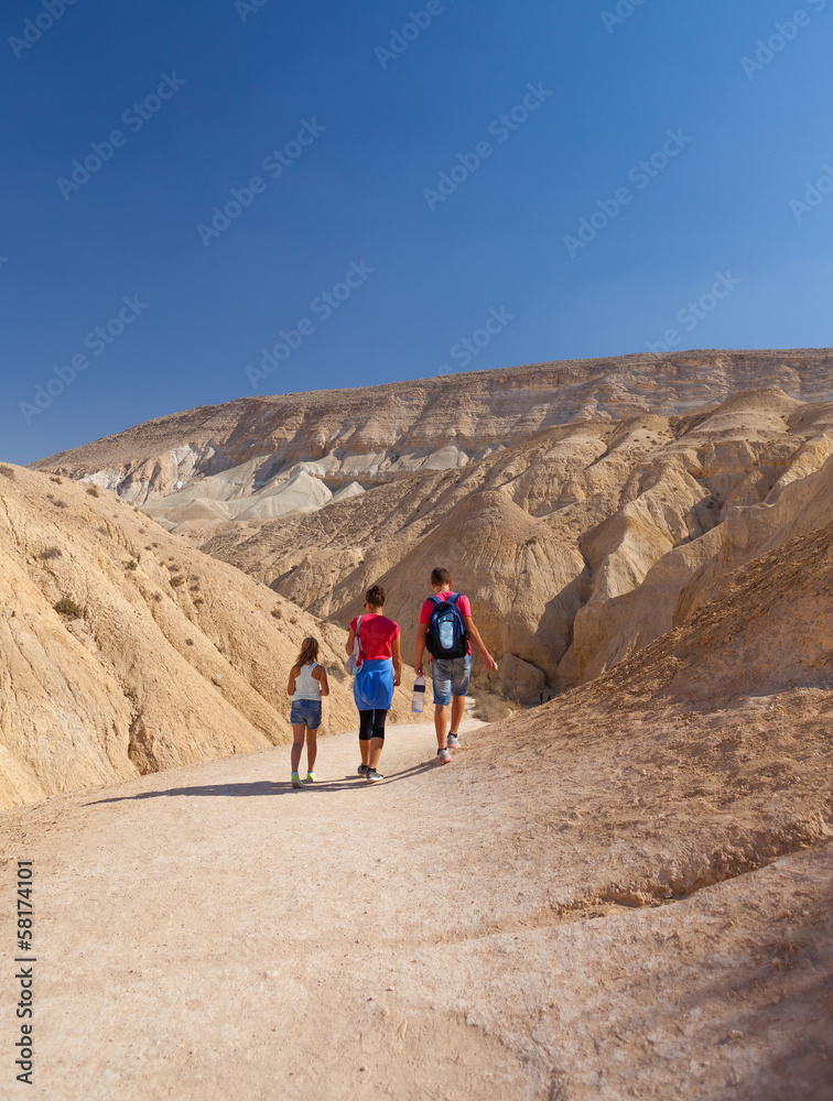 active family walk in the wilderness