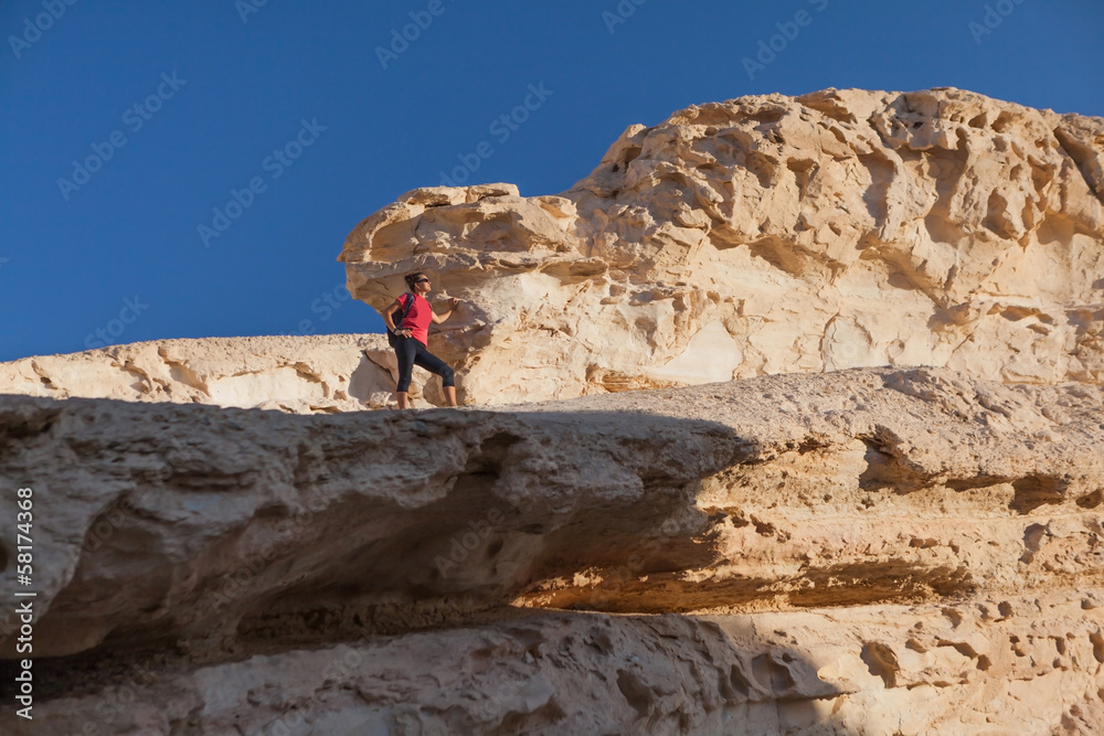 woman posing on the rocks in the desert