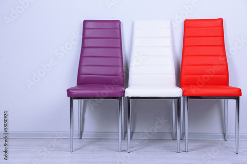 Modern  color chairs on wall background