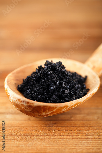 Hawaiian Black lava sea salt in rustic wooden spoon