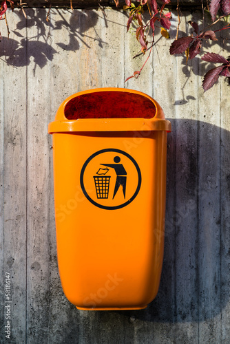 Orange plastic dust bin