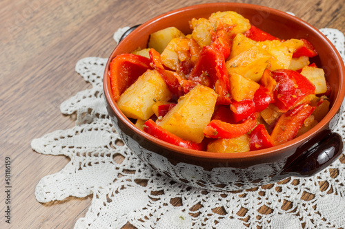 Fresh vegetable stew made of  potato, red bell pepper, tomato in