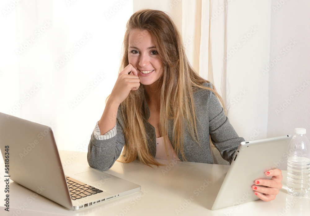 Young Business Woman working on her Laptop Young Business Woman working on her Laptop