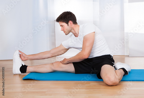 Happy Man Doing Stretching Exercise
