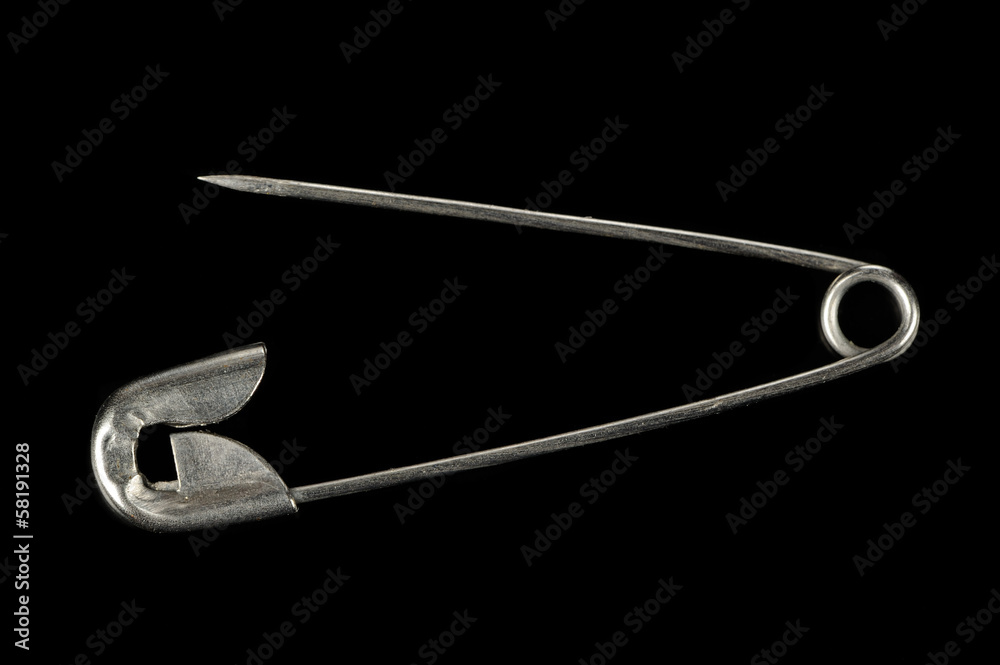 Safety Pin on Black Background Safety Pin on Black Background