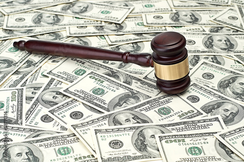 gavel on dollar background