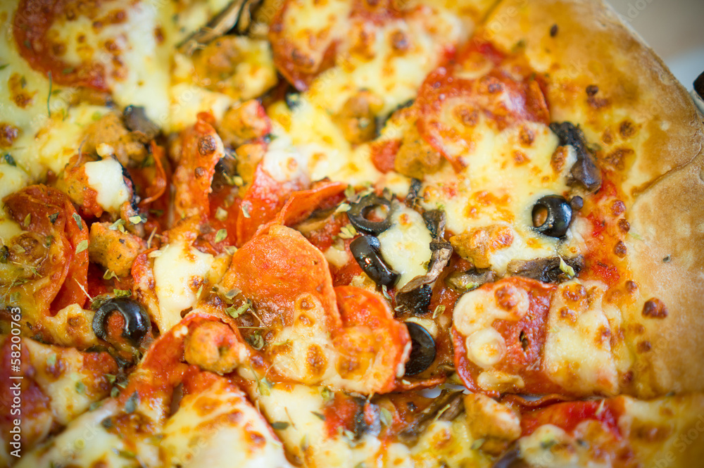 Fresh little italia pizza with pepperoni sausages and olives on Fresh little italia pizza with pepperoni sausages and olives on